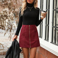 Women's high waist short hip skirt with zipper in black, shown on model.