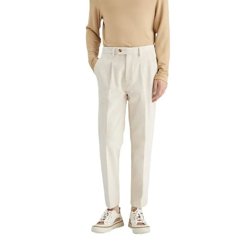 Men's beige corduroy straight leg loose fit trousers with a mid-rise elastic waistband.