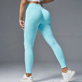 Women's solid-colour yoga pants with mid-waist design and hip-lifting effect in multiple colour options