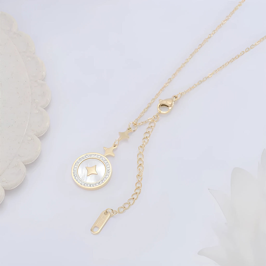 Gold titanium steel women's necklace with hexagonal star pendant on O-ring chain.