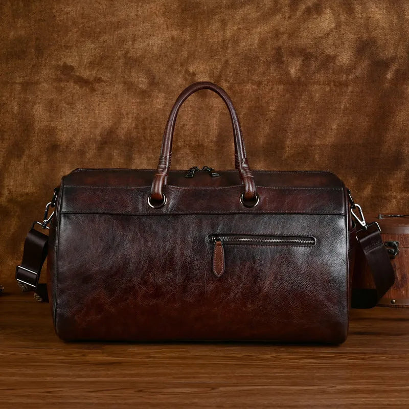 Handmade retro style leather bag in vintage brown colour showing first layer cowhide texture and large capacity design