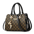 Geometric pattern ladies messenger bag in PU material with zipper and internal organisers.
