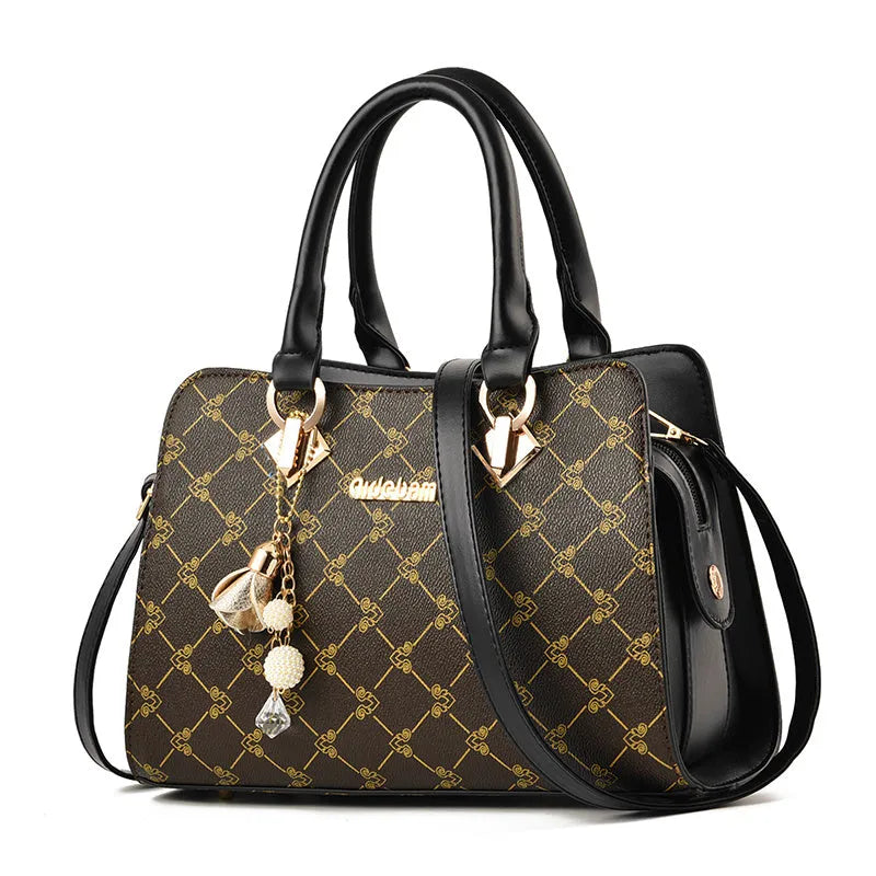 Geometric pattern ladies messenger bag in PU material with zipper and internal organisers.