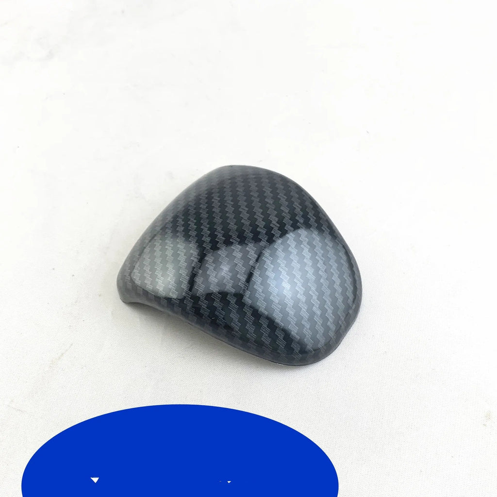 Car gear shift cover in carbon fibre pattern made from ABS plastic
