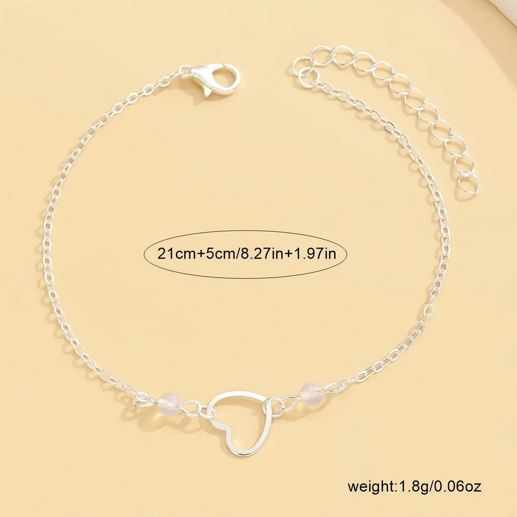 Women's adjustable anklet with geometric heart pendant in gold or silver tone