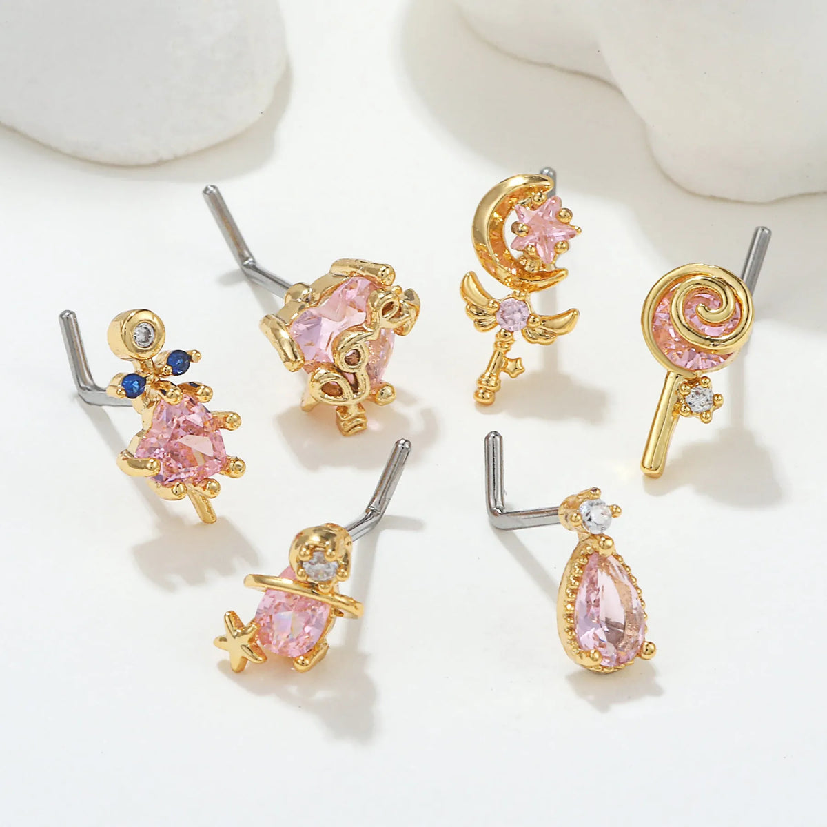 Geometric zircon nose stud in gold or white K tone with brass base and 18K plating