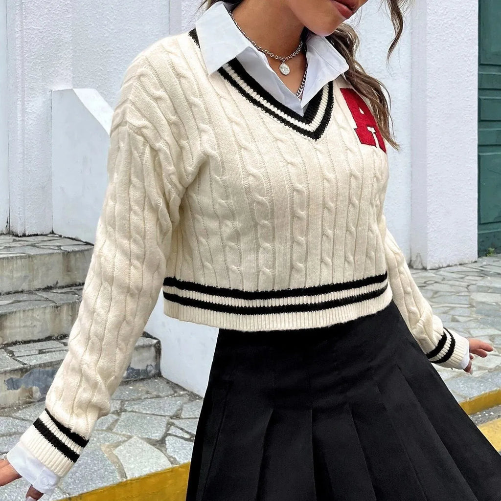 V-neck creamy white knitted shirt with slim stripes and patch detail on model