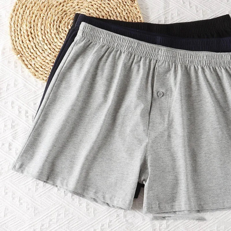Men's solid colour cotton boxer shorts with a high waist and loose fit.