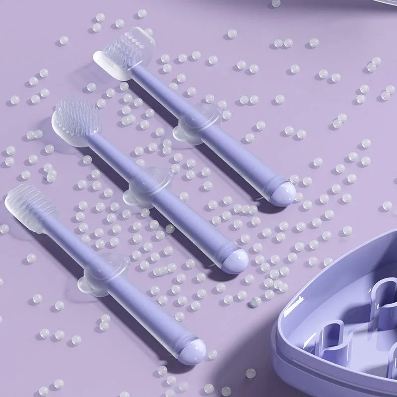 Blue, green, and purple silicone finger toothbrushes for cleaning cat and dog teeth.