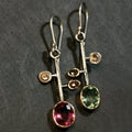 Crystal zircon retro asymmetric earrings in antique silver alloy on earring stand