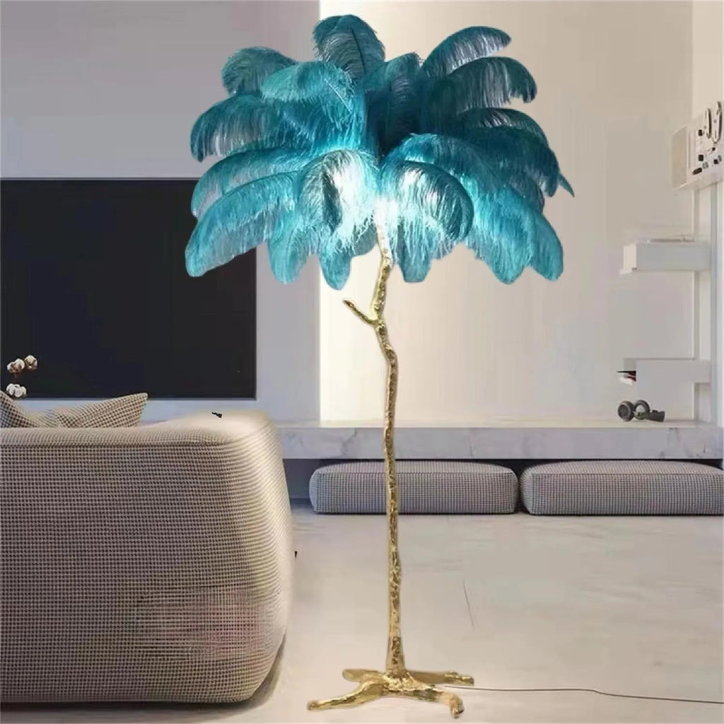 Tall decorative floor lamp with many white resin feathers and a dark base on a wooden floor.