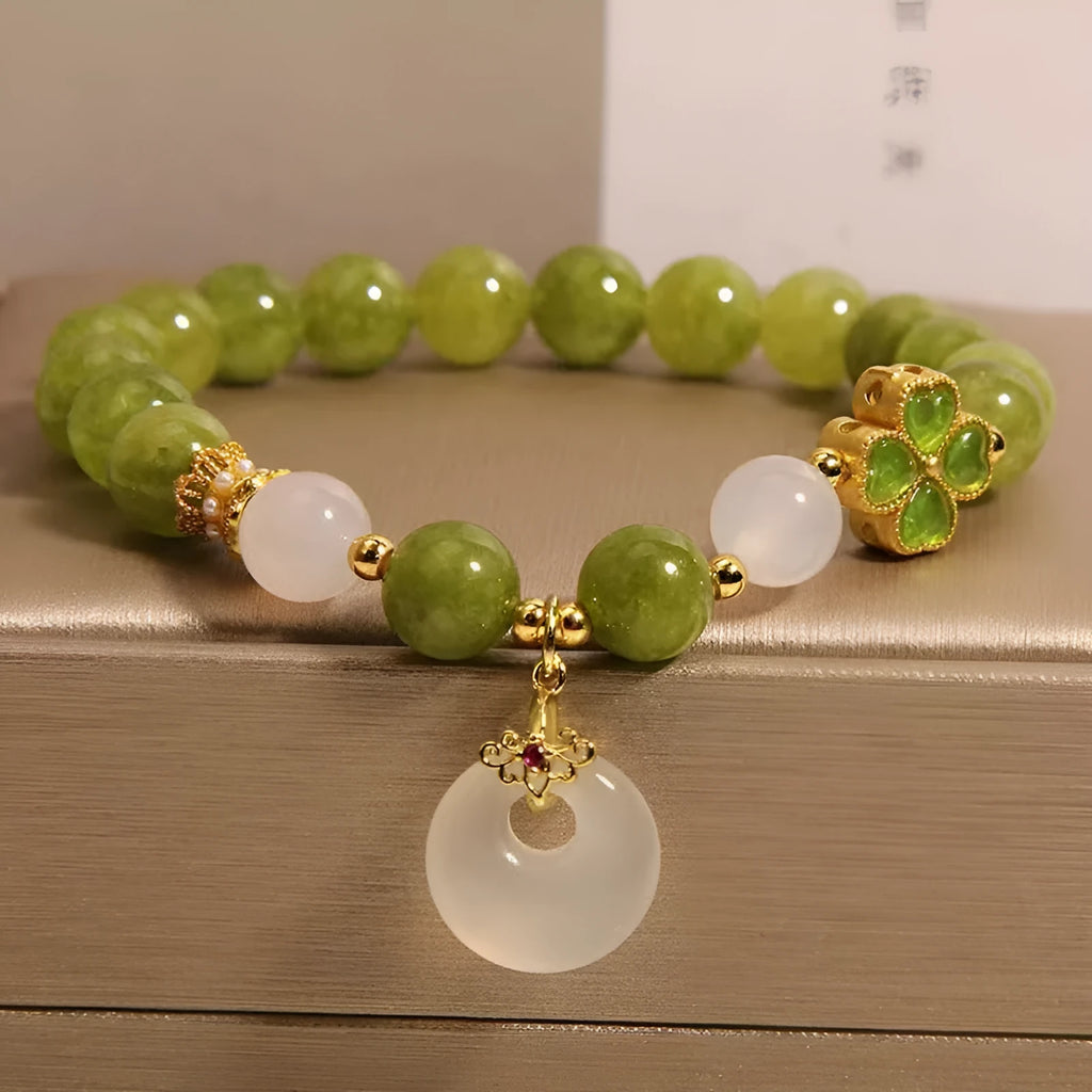 Green tourmaline four leaf clover women's bracelet with safety buckle, peace buckle, and lucky bag charm in New Chinese style.