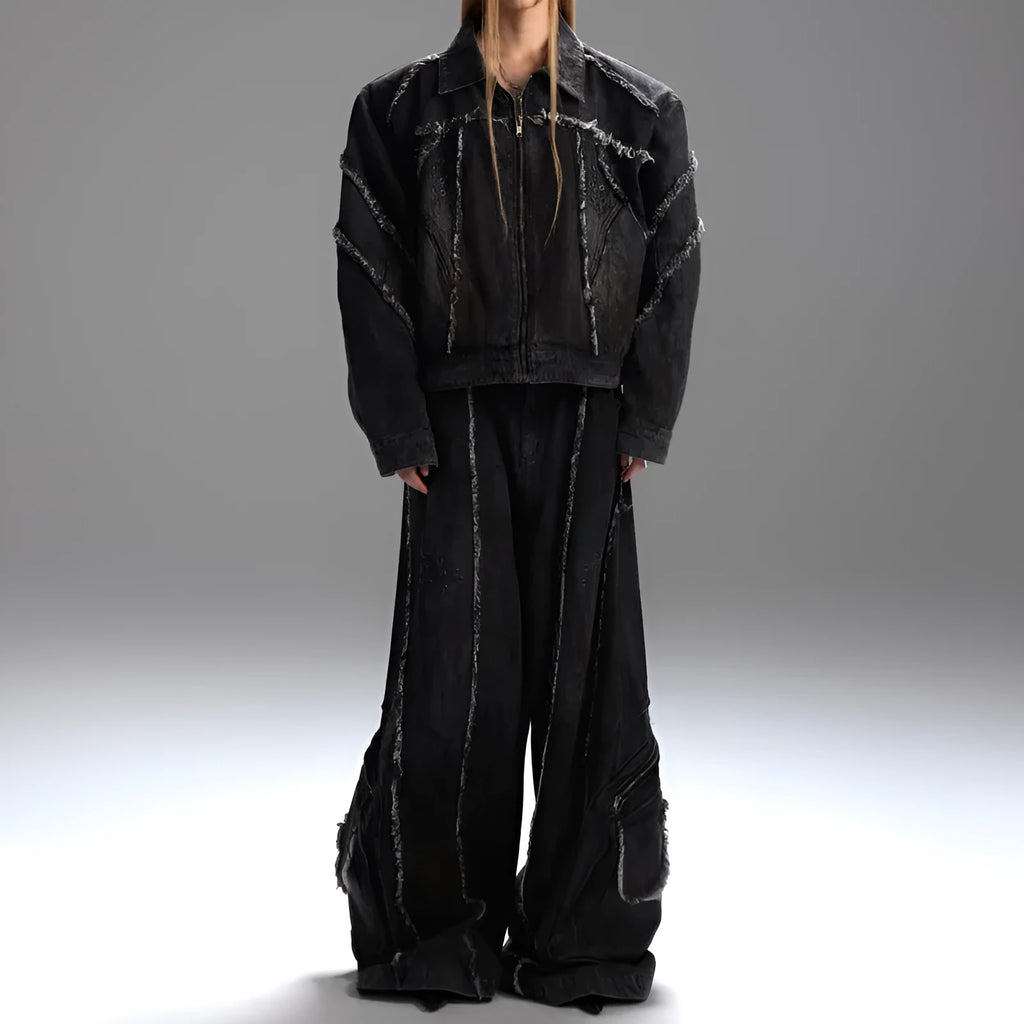 Loose fit black splash-dye distressed denim coat with padded shoulders and matching pants on model