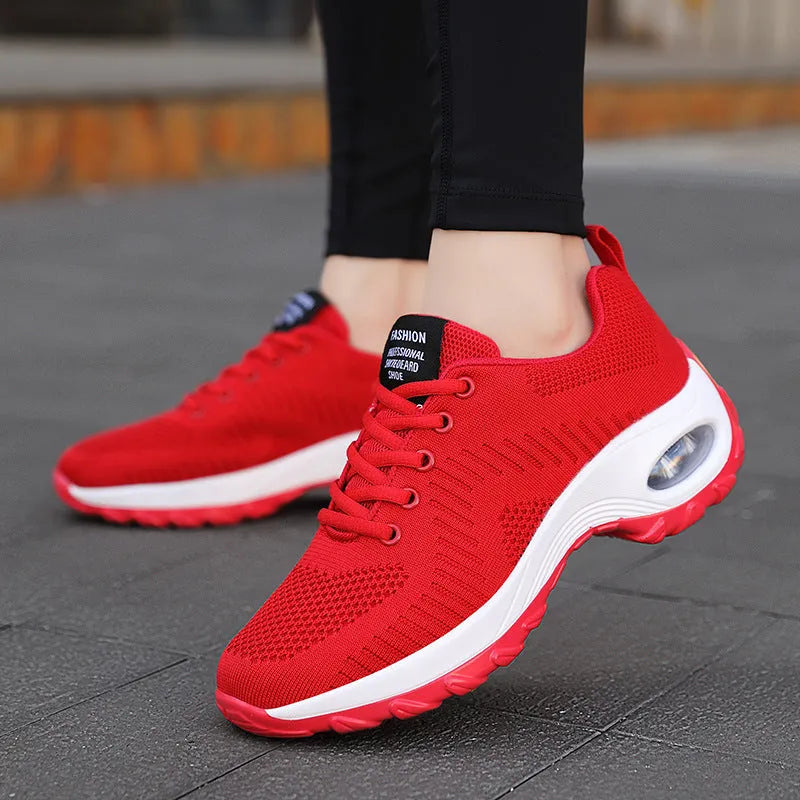 Red women's mesh lace-up low-top sneakers with a round toe and flat PU sole on a white background.
