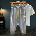 Men's black and grey ice silk harem pants showing dropped crotch design and mid waist fit