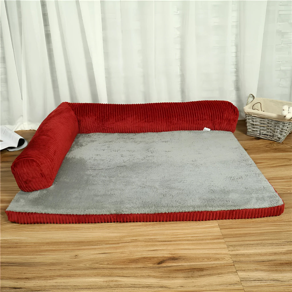 Corduroy pet dog sofa bed in grey colour with a bilateral bolster, shown on a wooden floor.