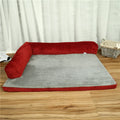 Corduroy pet dog sofa bed in grey colour with a bilateral bolster, shown on a wooden floor.