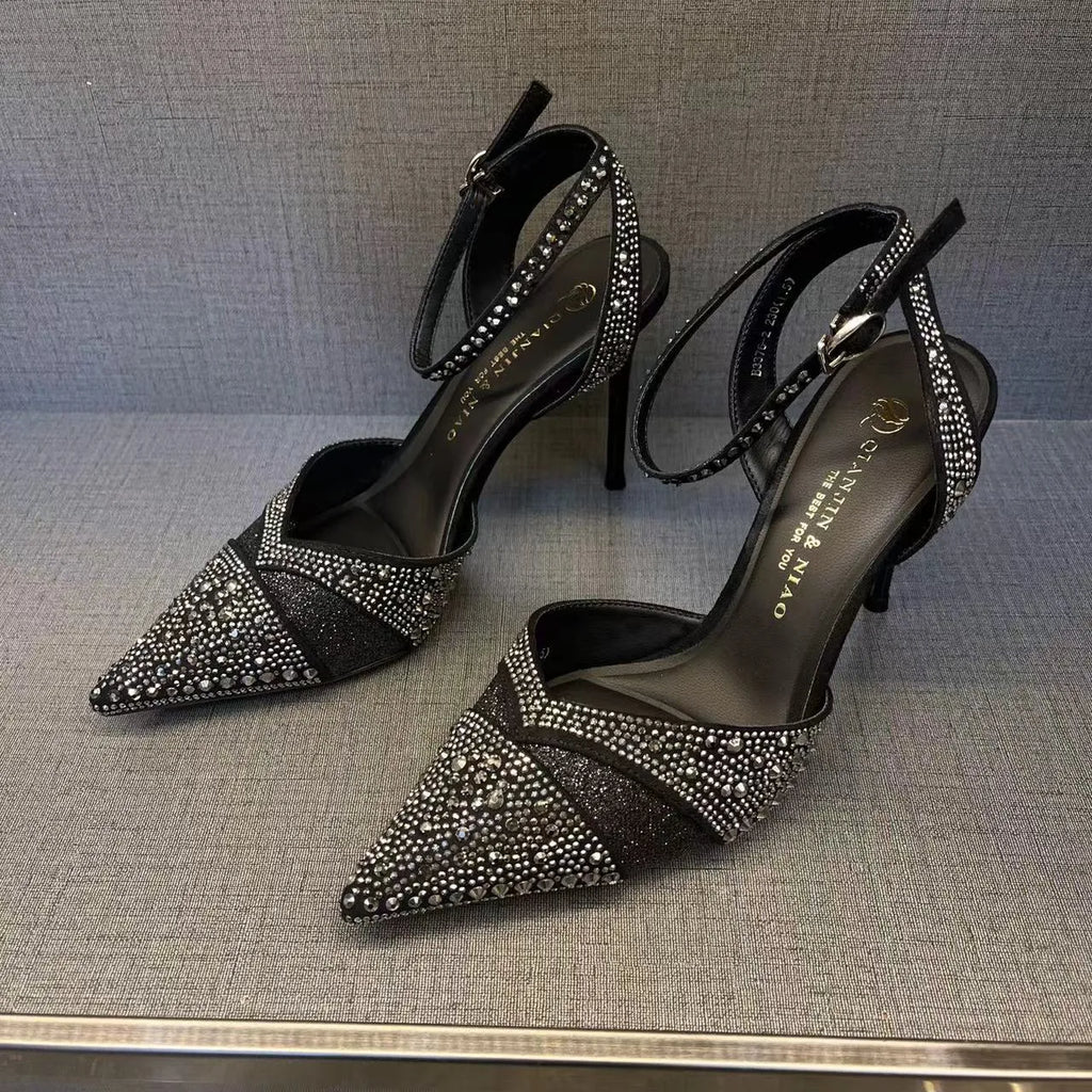 Women's black hollow stiletto heel pumps with a red sole and pointed toe.