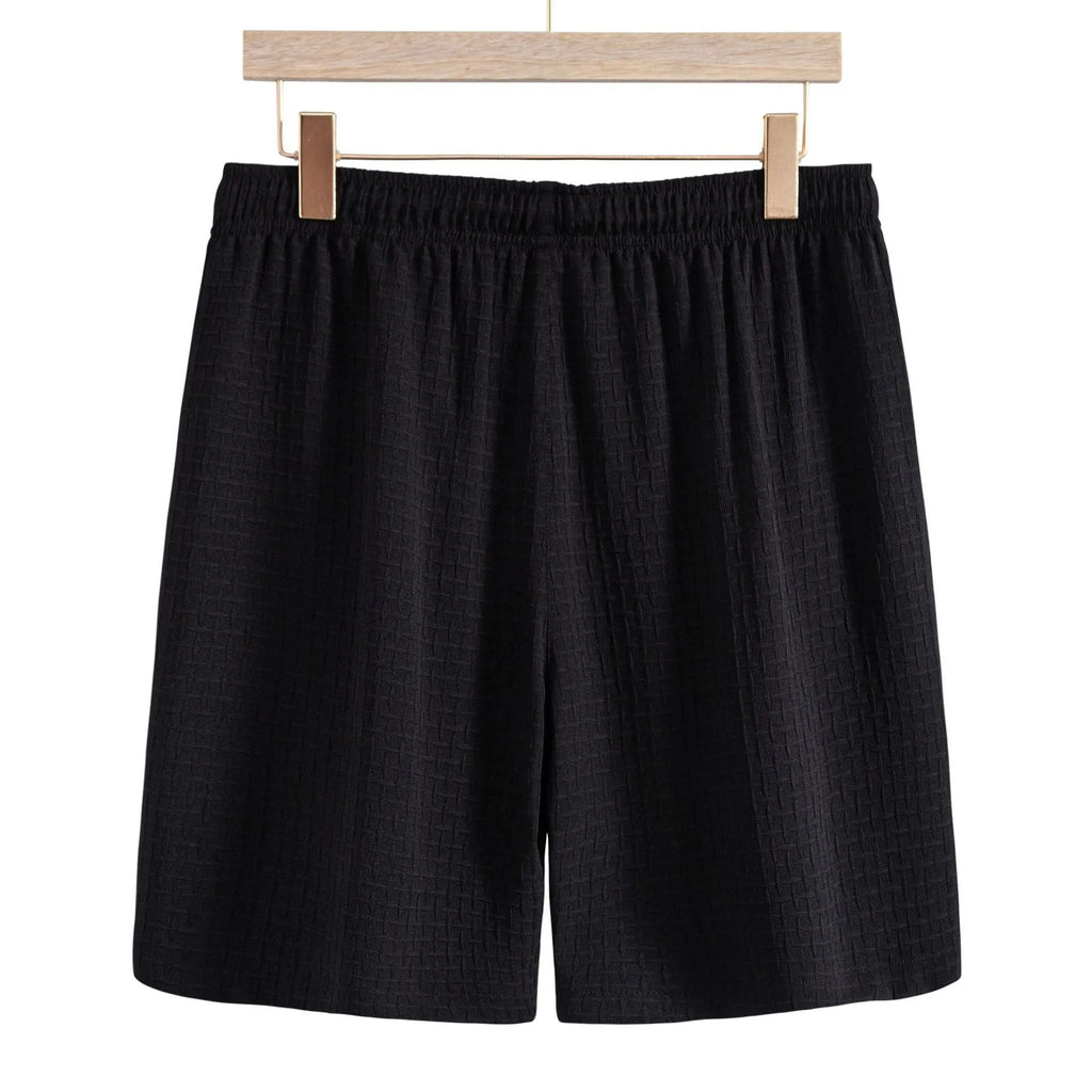 Men's loose fit cotton blend beach suit with short sleeve shirt and shorts in black.