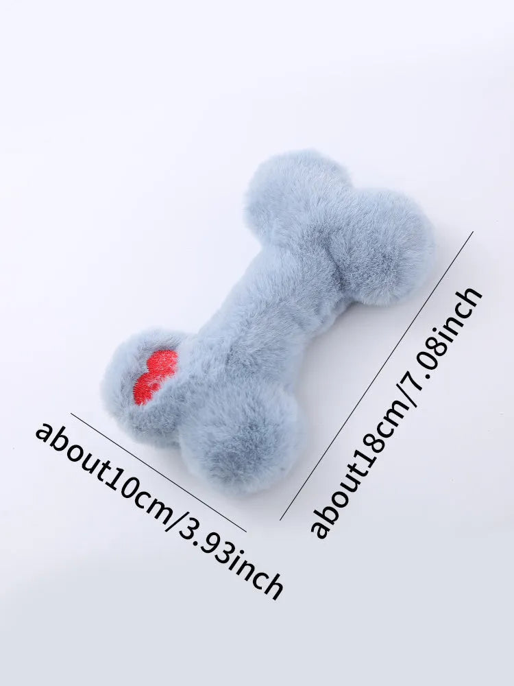 Blue Love Bone shaped plush dog toy with squeaker on a plain background.