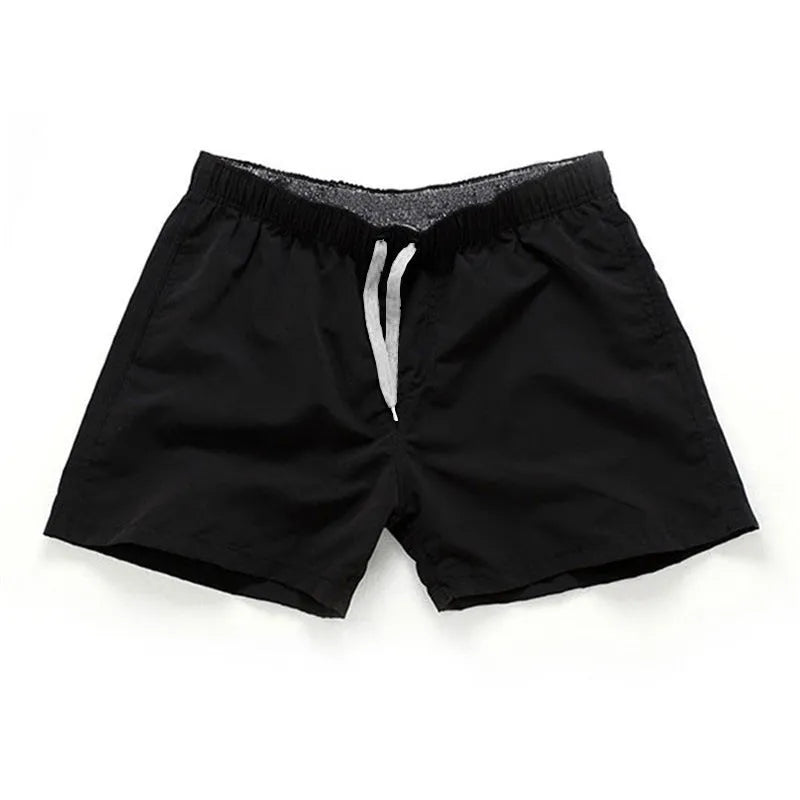 Men's straight leg beach shorts in polyester available in multiple colours and plus sizes.