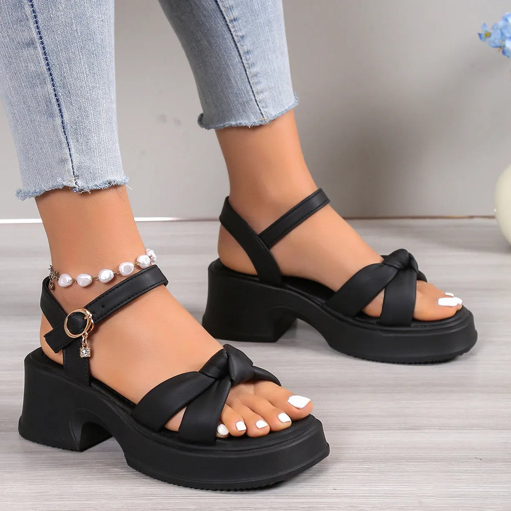 Women's black high heel slippers with thick platform sole and button closure