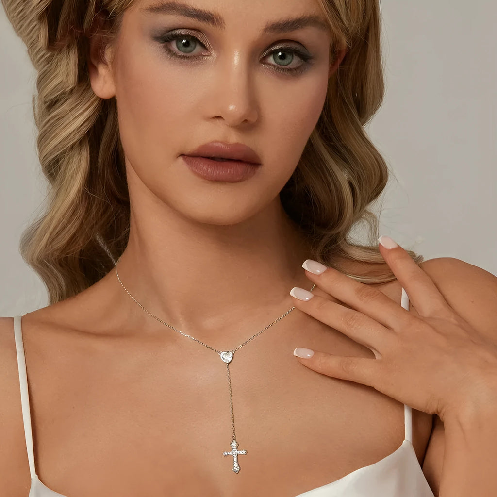 Silver necklace with a small cross pendant on an O-ring chain, shown in colour BSN384.