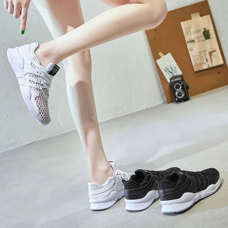 Casual mesh sneakers with hollow-out breathable design and round toe in black and white colour options