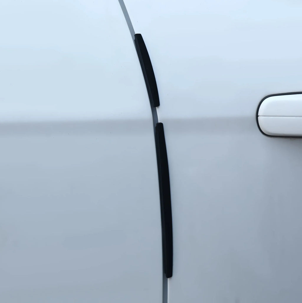 White plastic car door edge protective bumper strip anti-collision guard.