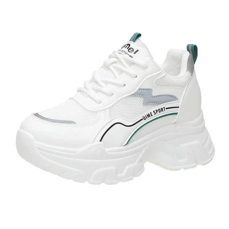 White women's low-top sports trainers with a front lace-up and cross-strap detail.