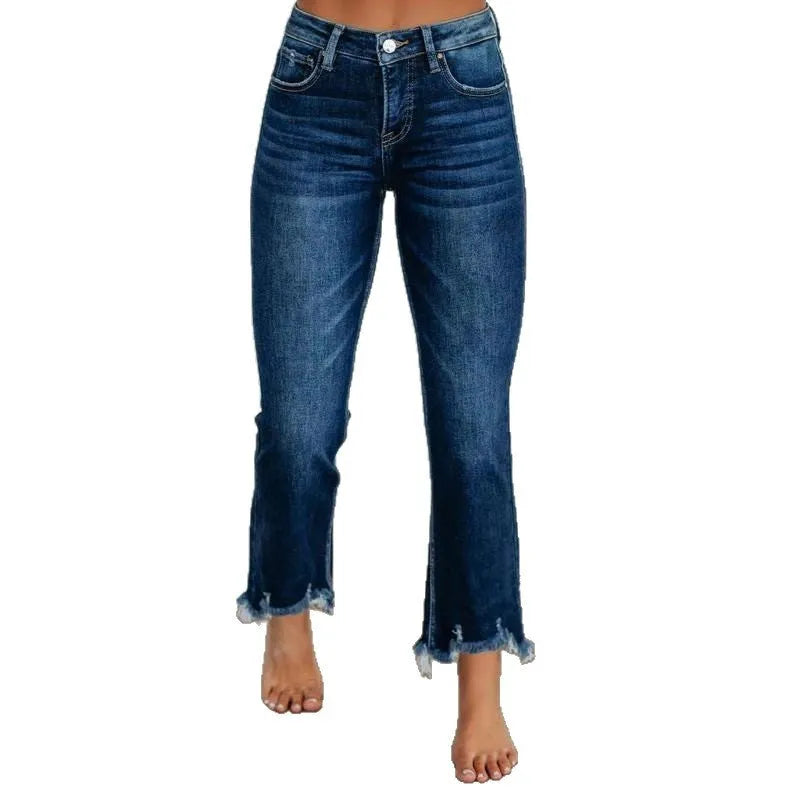 Women's solid colour cotton denim jeans with a hand-worn finish in dark blue.
