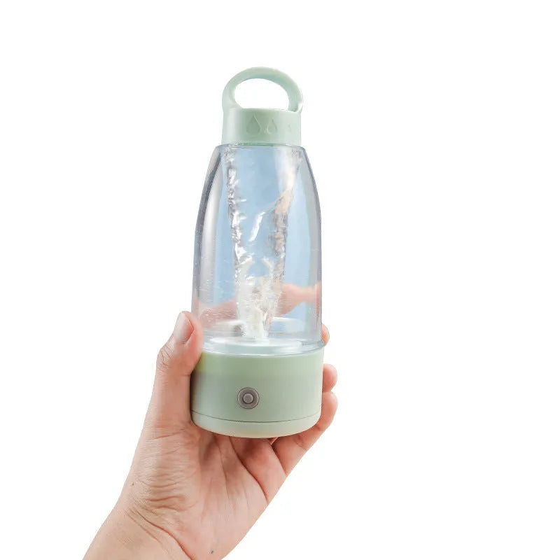 Automatic electric shaker bottle with USB port, handle, and blending motor in green, pink, or white colour.