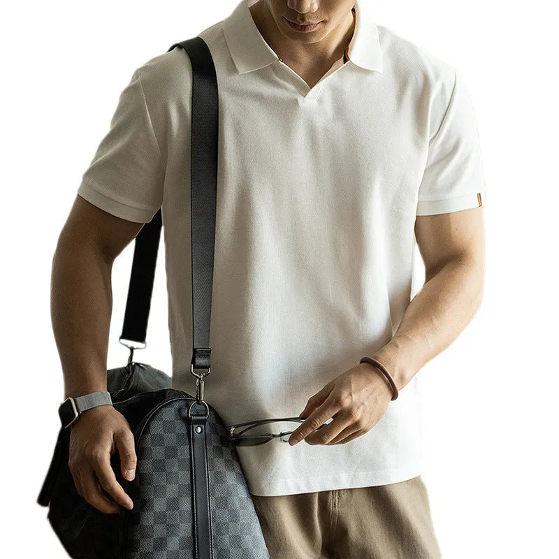 Man's blue short-sleeved cotton blend polo shirt with a collar, regular fit for summer.