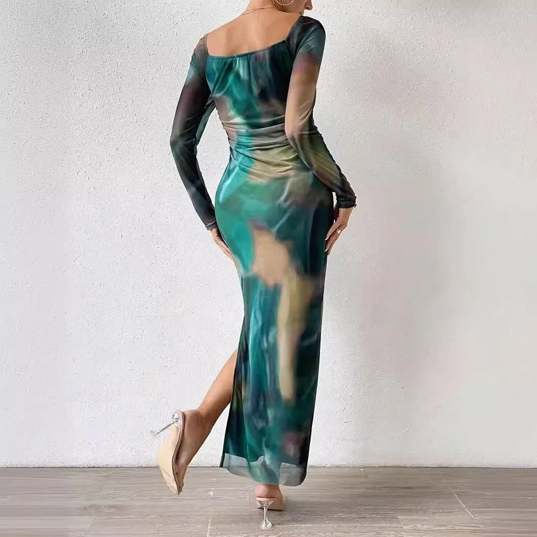 Women's long green mesh dress with fishtail skirt, gradient colour print, pleats, and a square neckline.