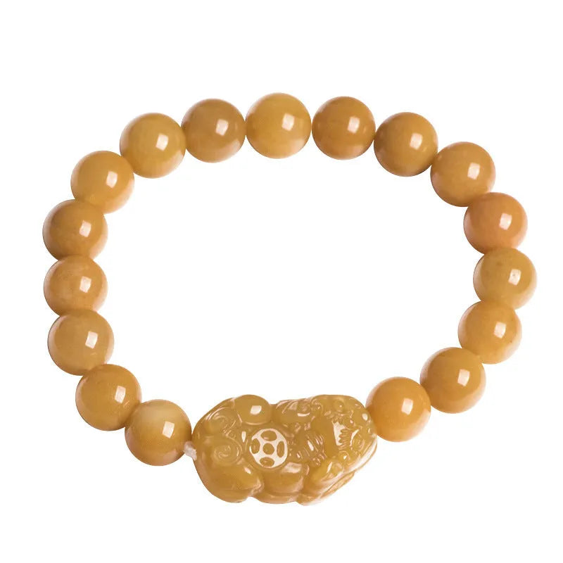 Hand-carved Golden Thread Jade money bracelet showing detailed coin design on round jade beads.