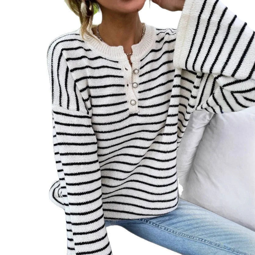 Women's black striped casual top with drop-shoulder sleeves and button details