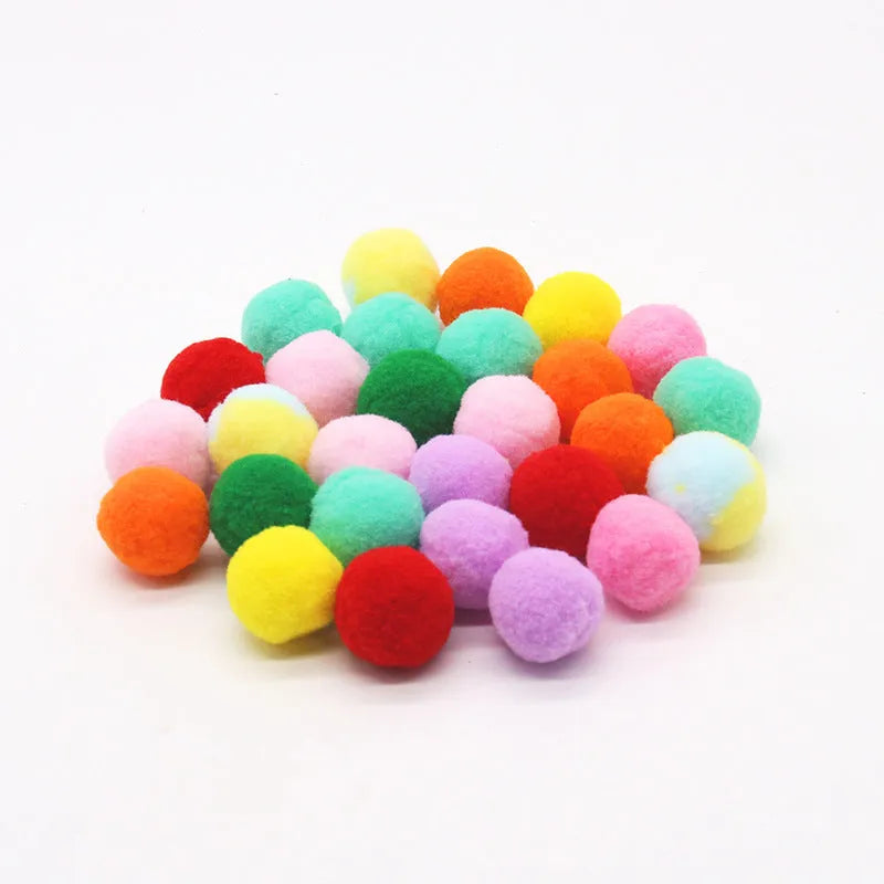 Plush ball launching gun for dogs next to a pile of soft coloured yarn balls.
