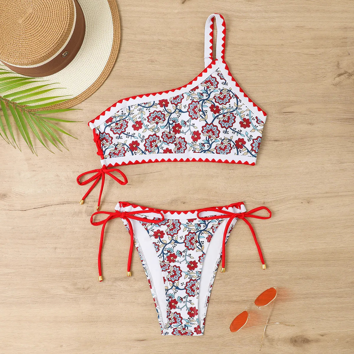 Women's one-shoulder floral bikini set in blue or red, sizes S-XL, polyester lining, two-piece swimsuit.