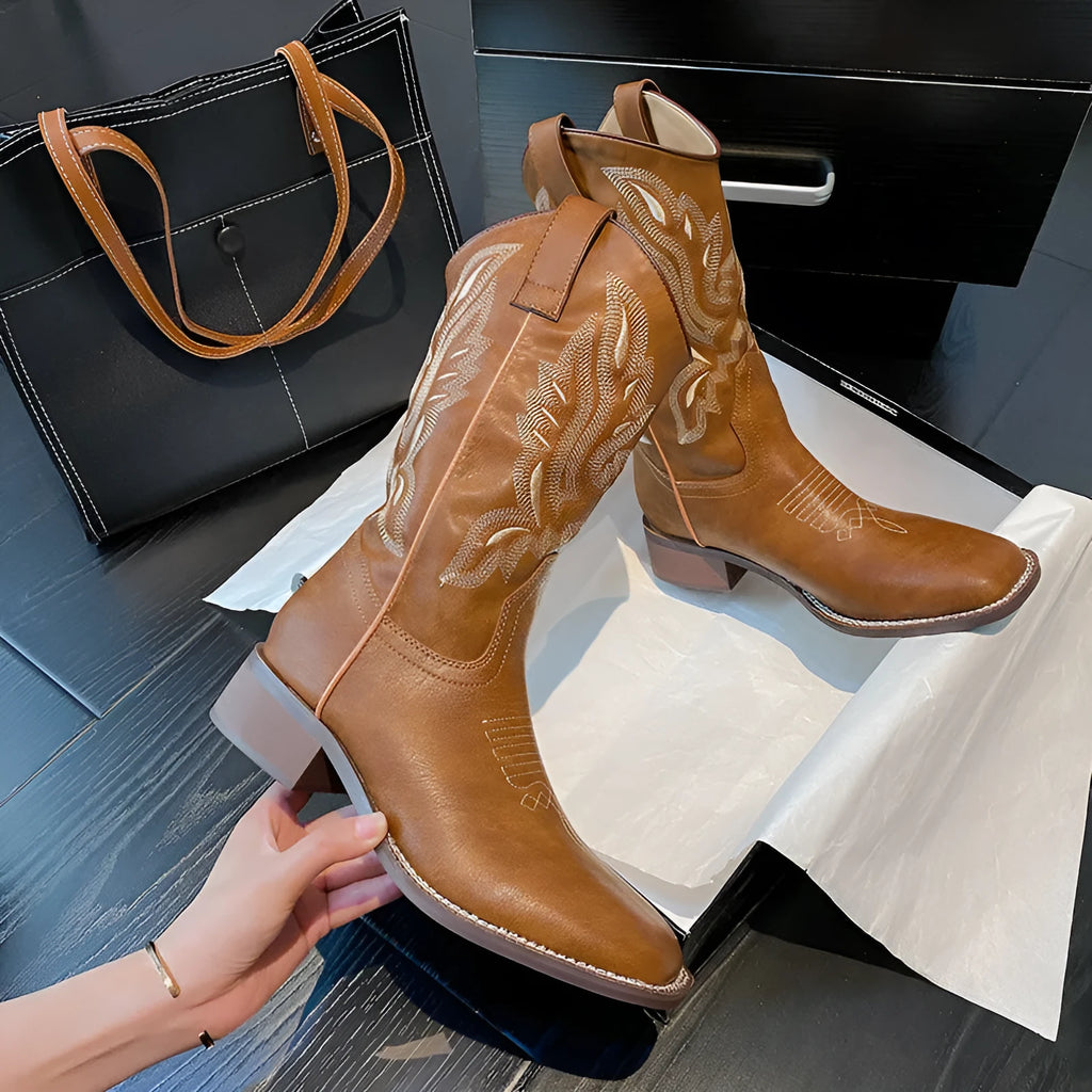 Brown embroidered women's mid-calf Martin boots with leather lining and a low square heel.