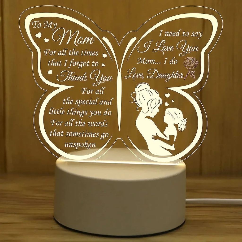 White heart-shaped acrylic table lamp with a touch switch base on a wooden surface.