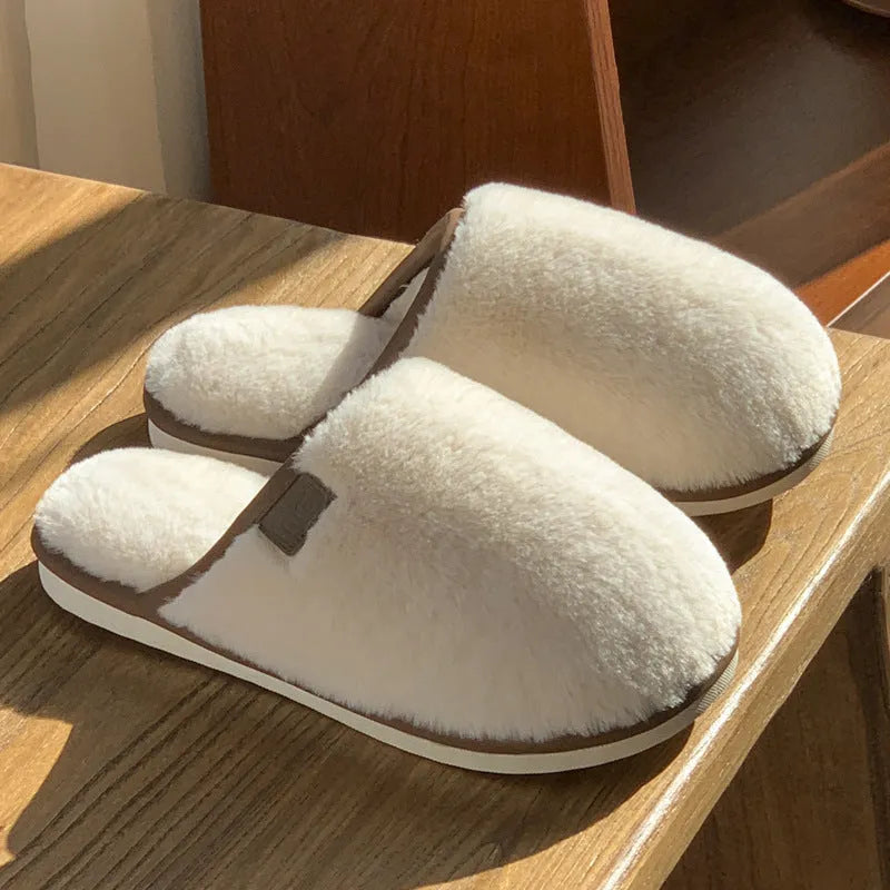 A pair of solid colour plush winter slippers with a non-slip PVC sole, shown in available colours.