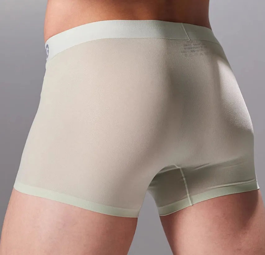 Men's seamless fitness shorts in black, shown flat, highlighting the lightweight fabric and lack of seams.