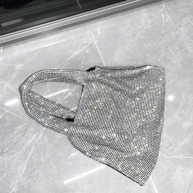 Silver shiny rhinestone handbag made of cotton thread with open pocket, designed for evening parties and dinners.
