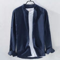 Man wearing a loose-fit light blue casual long sleeve shirt made from cotton linen fabric.