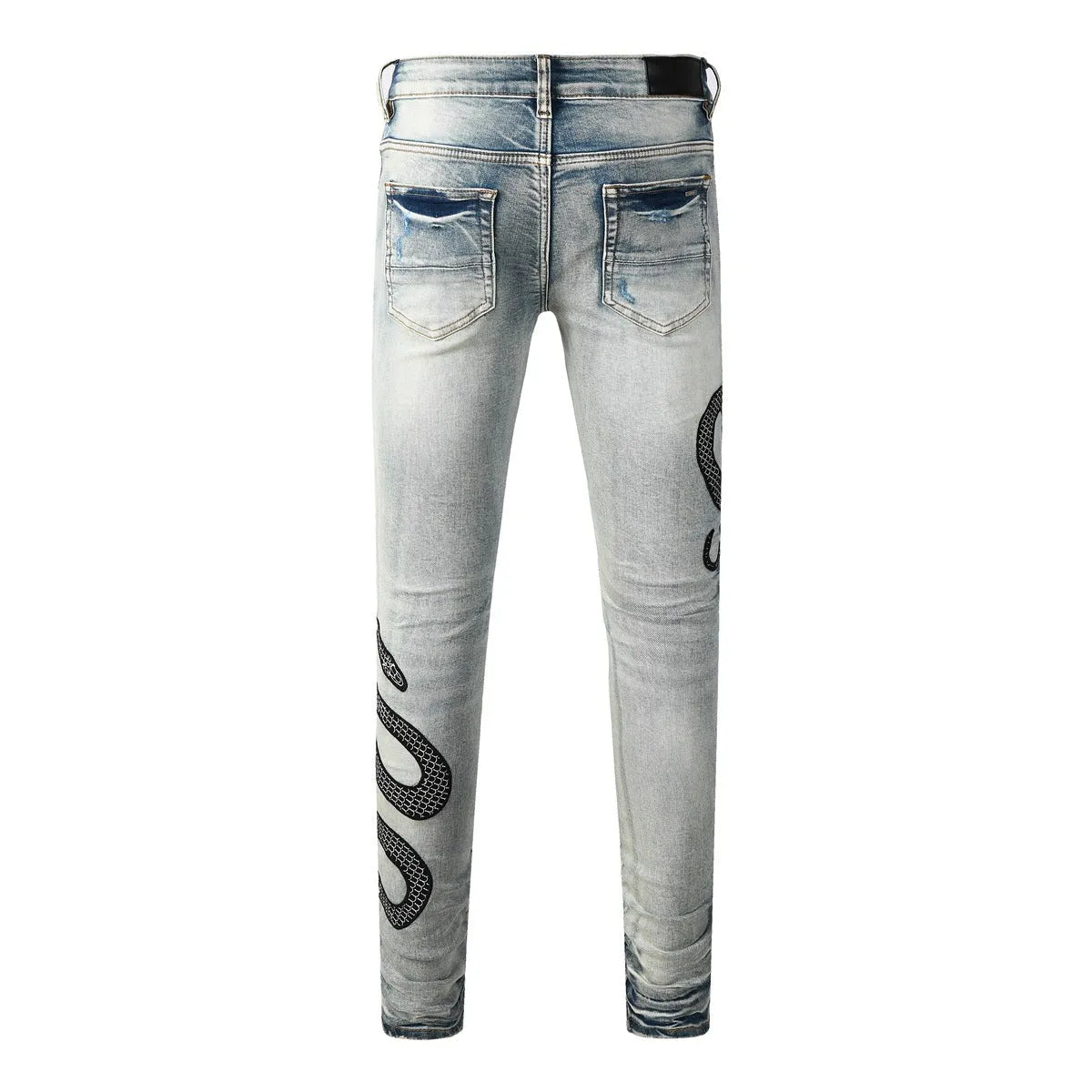 Distressed blue skinny jeans with wash detailing and button fly on mid waist design