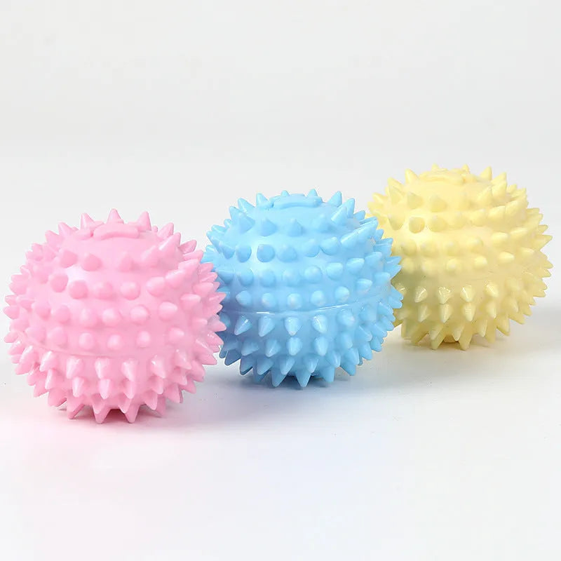 Blue TPR rubber dog toy ball with raised footprint texture for teeth cleaning, 6cm diameter.