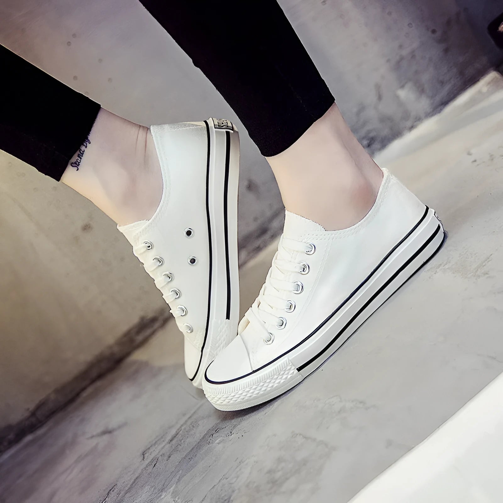 Women's casual canvas shoes in solid colours on a flat sole, showing lace-up fastening.