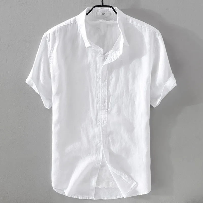 Man wearing a loose fit apricot coloured short sleeve linen cotton blend shirt.