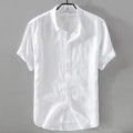 Man wearing a loose fit apricot coloured short sleeve linen cotton blend shirt.