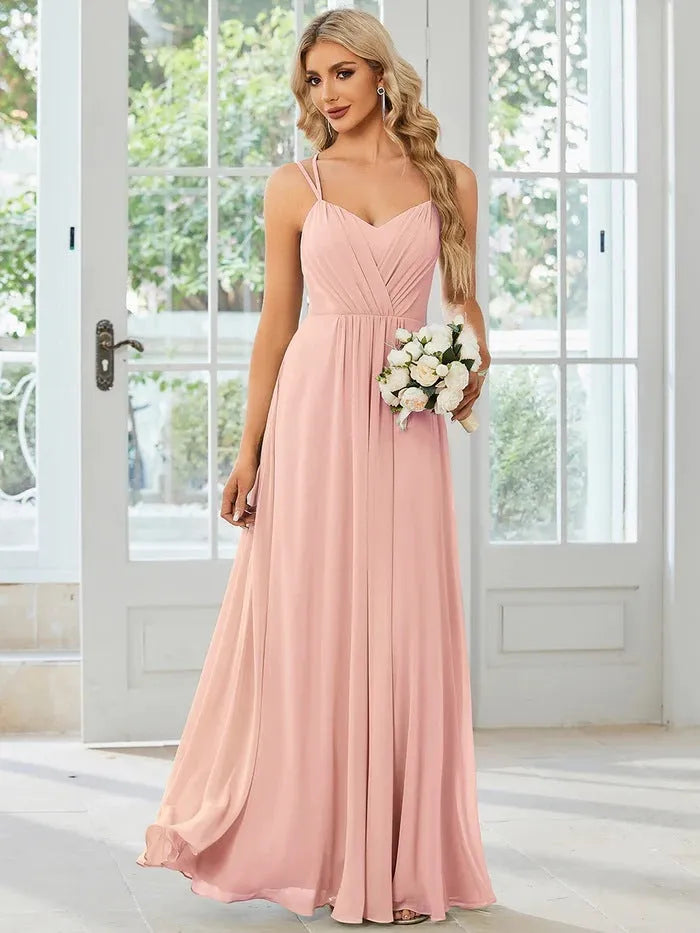 Women's sleeveless long A-line dress in polyester with pleated detailing, shown in light green colour
